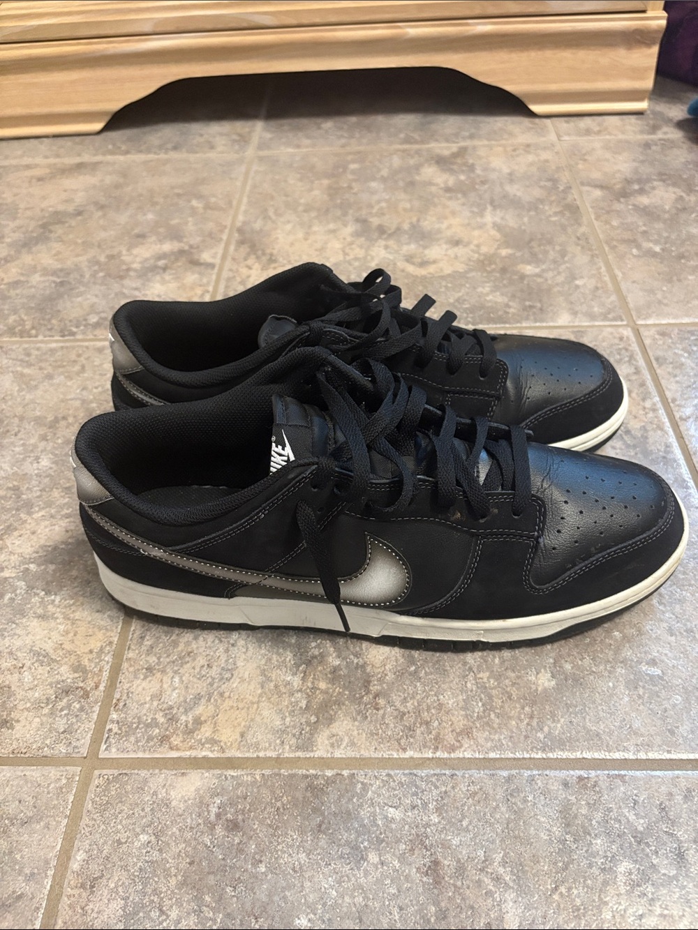 Nike Black Low-Top Sneakers with Silver Swoosh Accent